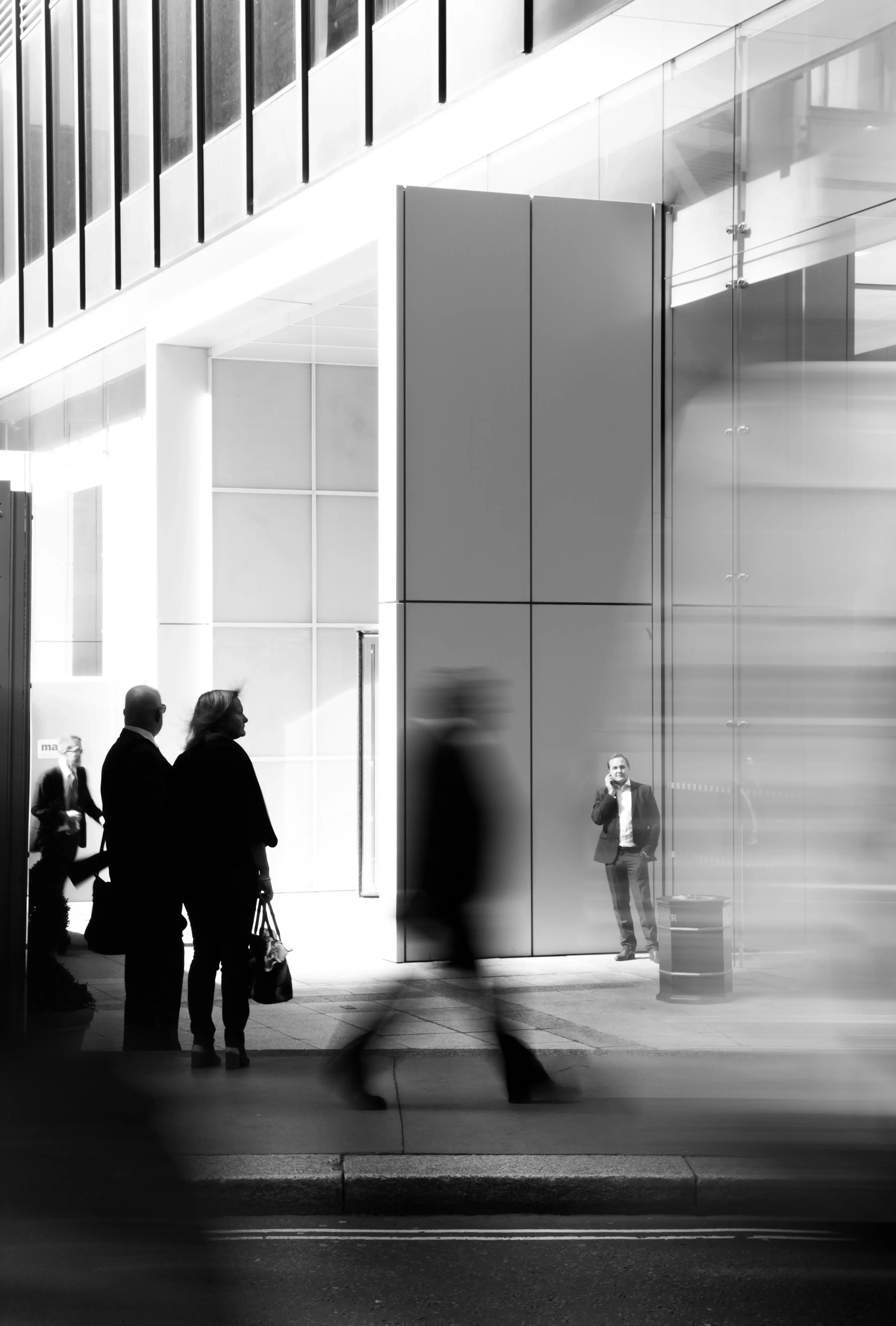 office-worker-on-phone-frozen-amongst-busy-street-scene