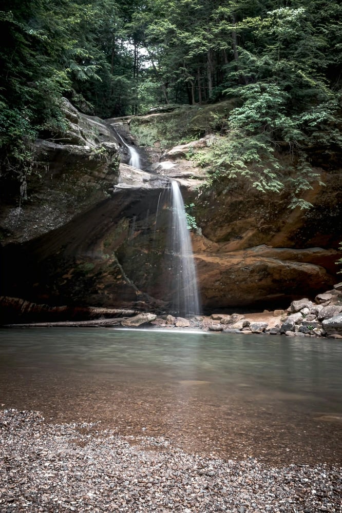 Peaceful waterfall in a quiet forest, reflecting clarity, wellbeing and calm guidance