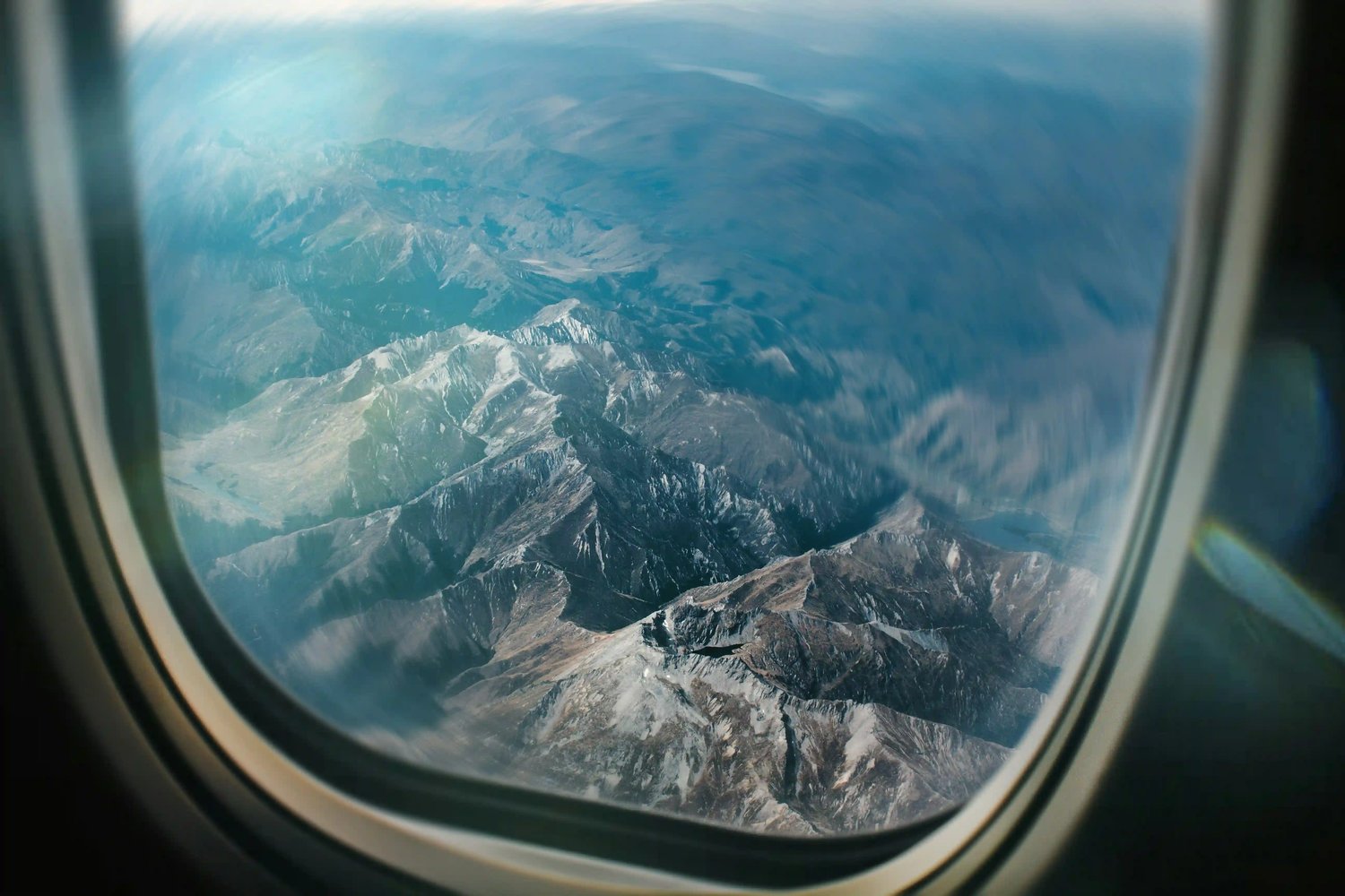 view-of-mountain-range-from-aircraft-window