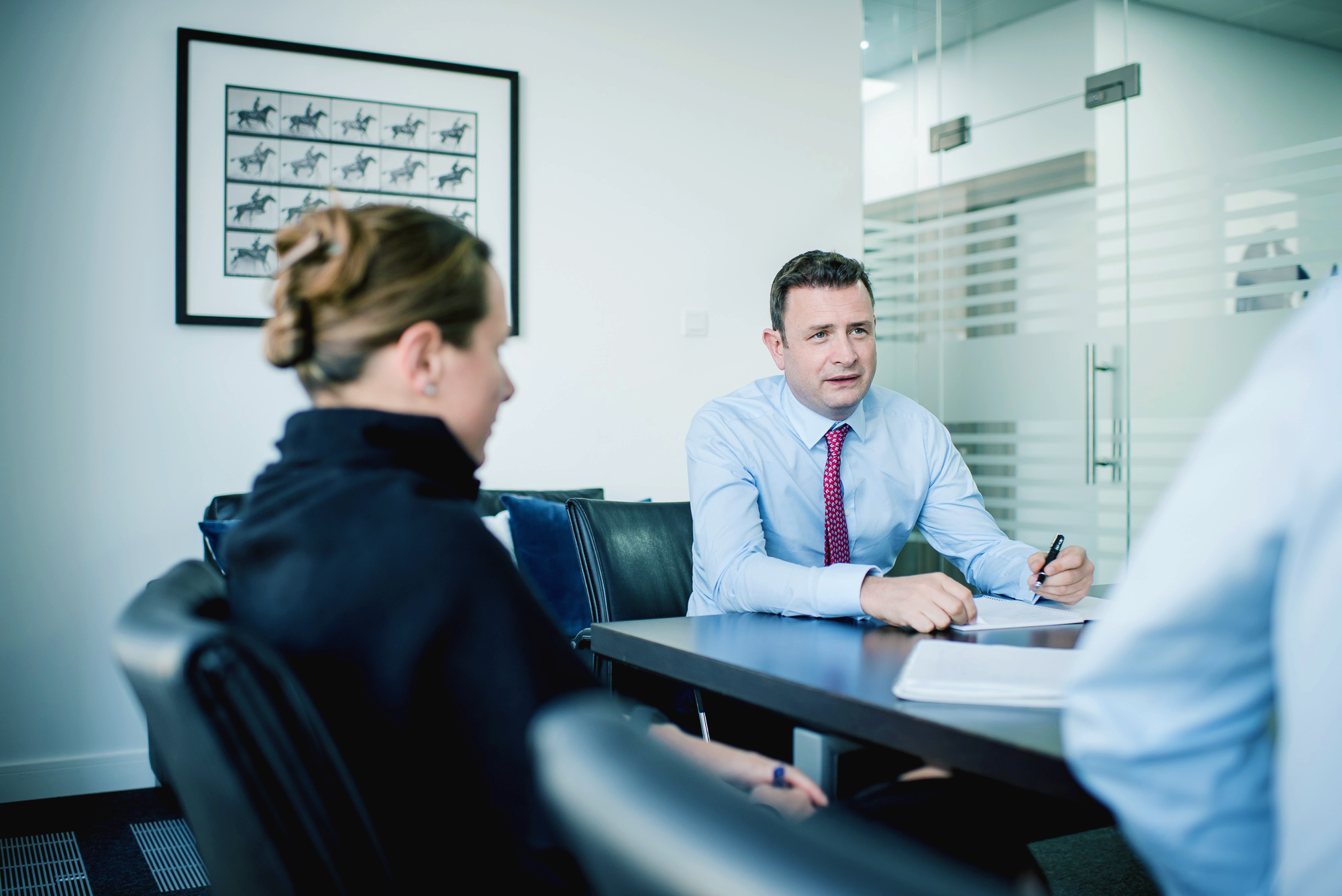 Financial planning experts explaining the features of a private bank.